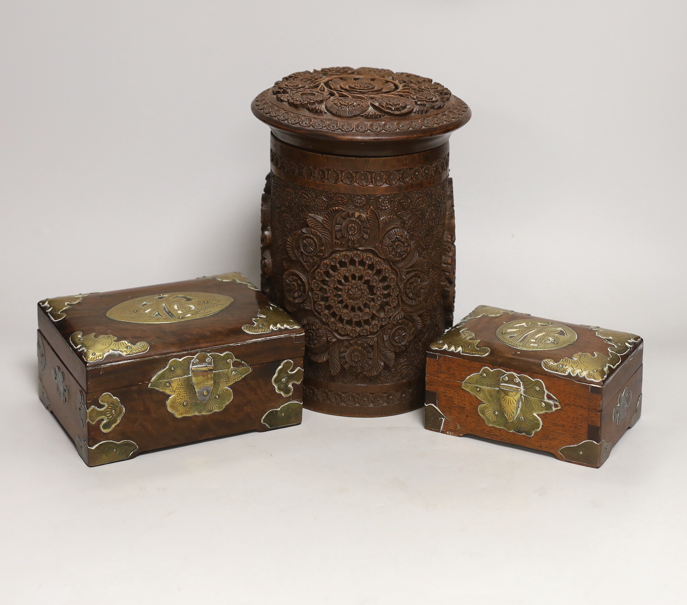 An Indian carved wood humidor and two Chinese brass mounted boxes, tallest 22cm high